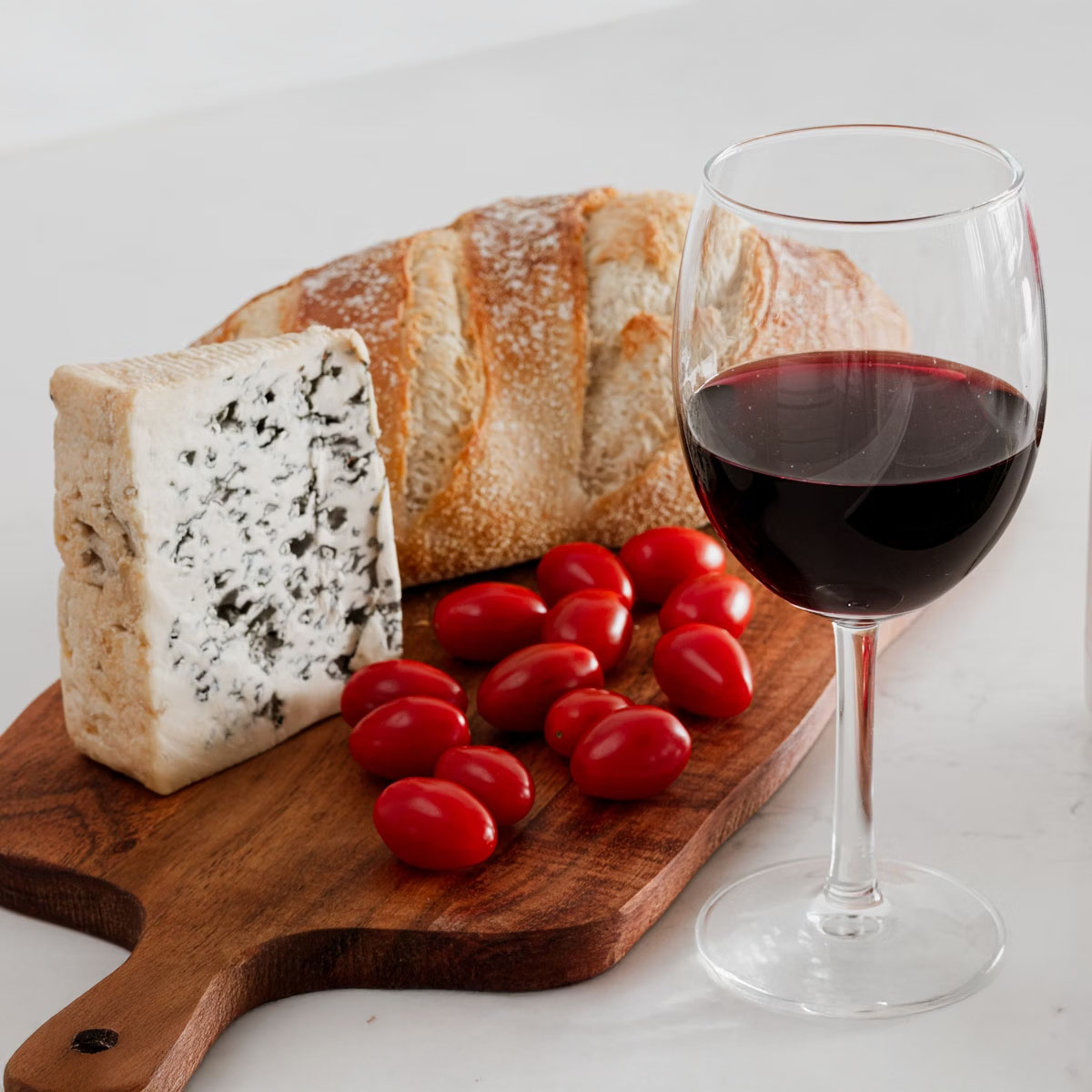 a glass of red wine with apperitive