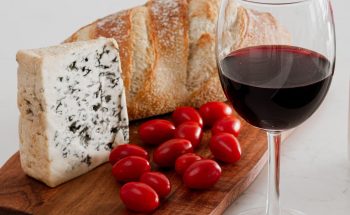 a glass of red wine with apperitive